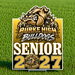 A custom yard sign celebrating 'Burke High Bulldogs Senior 2027' displayed on a green grass background. The sign features a bold bulldog mascot graphic in gold, brown, and white, with the text 'BURKE HIGH BULLDOGS', 'SENIOR', and '2027' in large, stylized lettering.