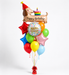 A birthday balloon bouquet featuring a dachshund-shaped foil balloon with a birthday cake and 'Happy Birthday' script, surrounded by assorted colorful balloons including red, orange, green, blue, yellow, pink, and light blue, with a red tassel at the base.