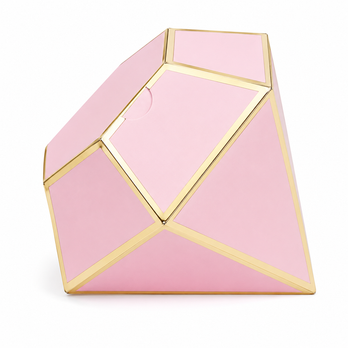 Diamond-shaped favor box with soft pink panels and metallic gold trim on a white background.