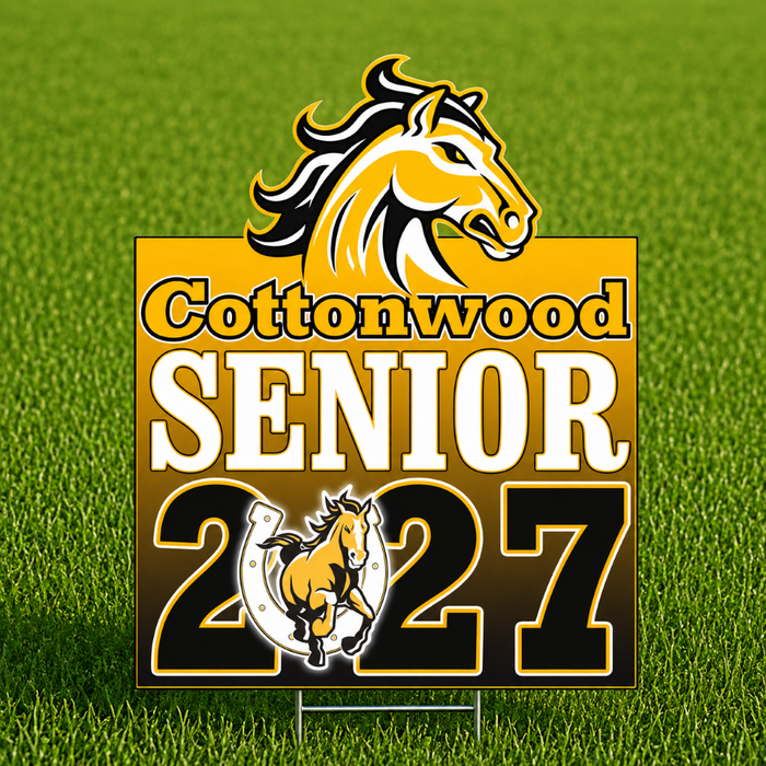A rectangular yard sign on a metal stake featuring a yellow and black cottonwood horse logo, the text 'Cottonwood SENIOR 2027' in white and black, and a small horse-and-rider emblem near the bottom, shown against a green grass background.