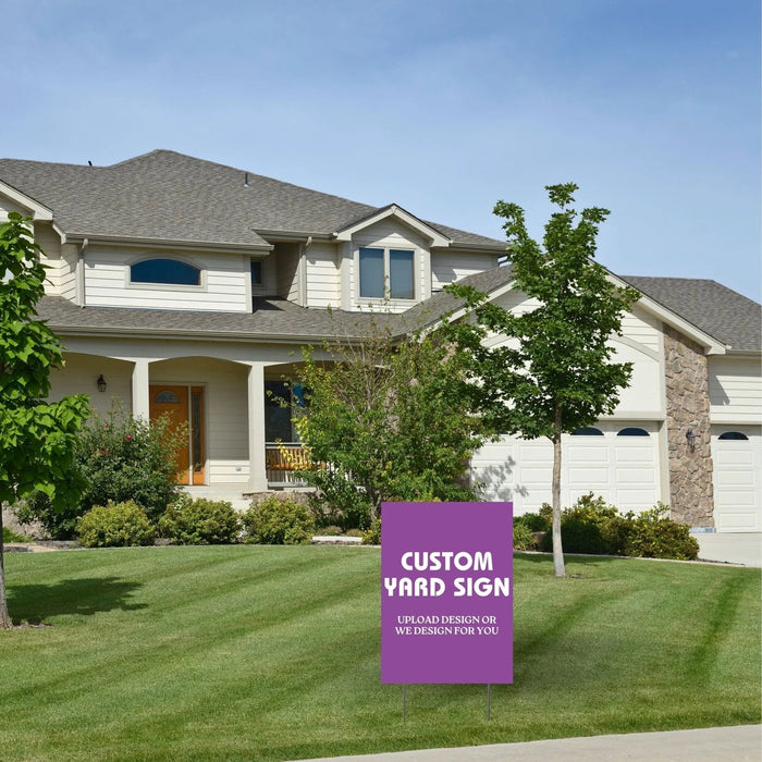 Purple rectangular yard sign with white text reading "CUSTOM YARD SIGN" and "UPLOAD DESIGN OR WE DESIGN FOR YOU" displayed in a residential front lawn.