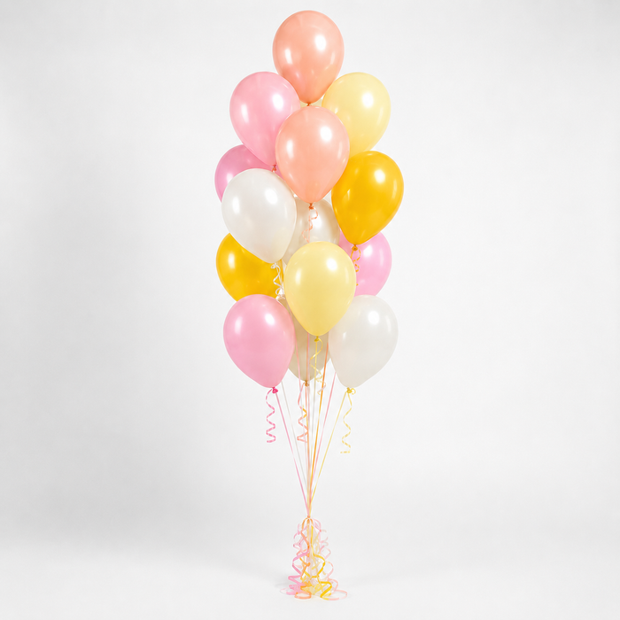 Dainty Unicorn themed accent balloon bouquet with pink, peach, pale yellow, golden yellow, and soft white balloons with curling ribbon.