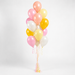 Dainty Unicorn themed accent balloon bouquet with pink, peach, pale yellow, golden yellow, and soft white balloons with curling ribbon.