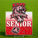 A rectangular yard sign with a sports graphic for East Leopard Senior 2027, displayed on a metal stake in a green grass field. The sign features a red-to-white gradient background with a graphic of a spotted leopard, the text 'EAST LEOPARDS', and 'SENIOR 2027'.