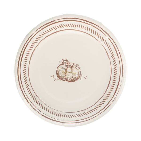 Round paper plate with decorative pumpkin design and brown rim on a white background