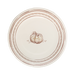 Round paper plate with decorative pumpkin design and brown rim on a white background
