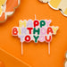 Product photo of Playful Brights 'Happy Birthday to You' Wax Candle — a Hootyballoo party product shown on a plain background.