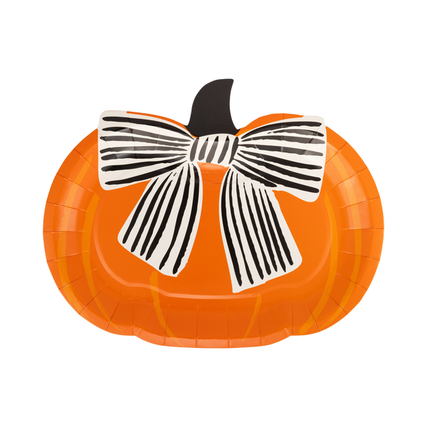 Pumpkin-shaped paper plate with a black and white bow on a white background