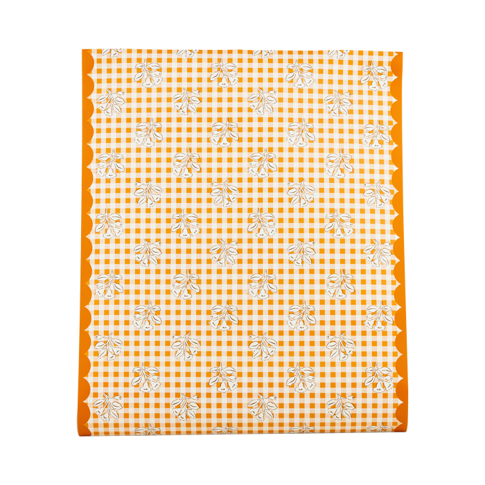 Orange and white checkered table runner with floral patterns on a white background