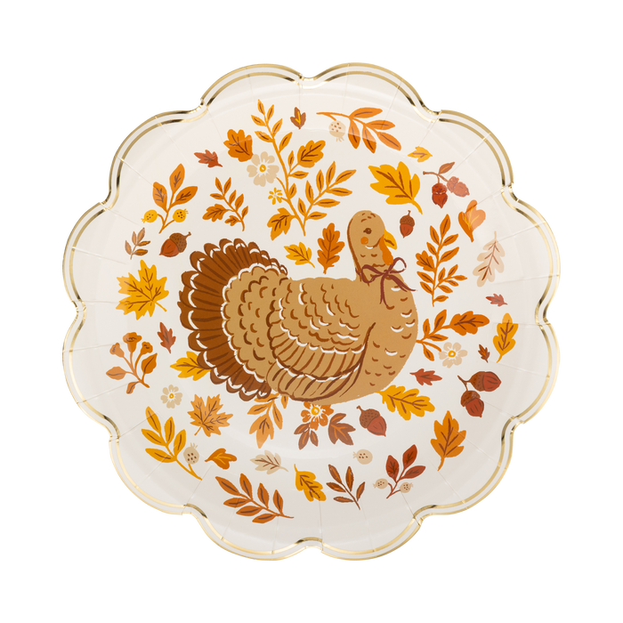 Decorative plate with a turkey and autumn leaves design on a white background