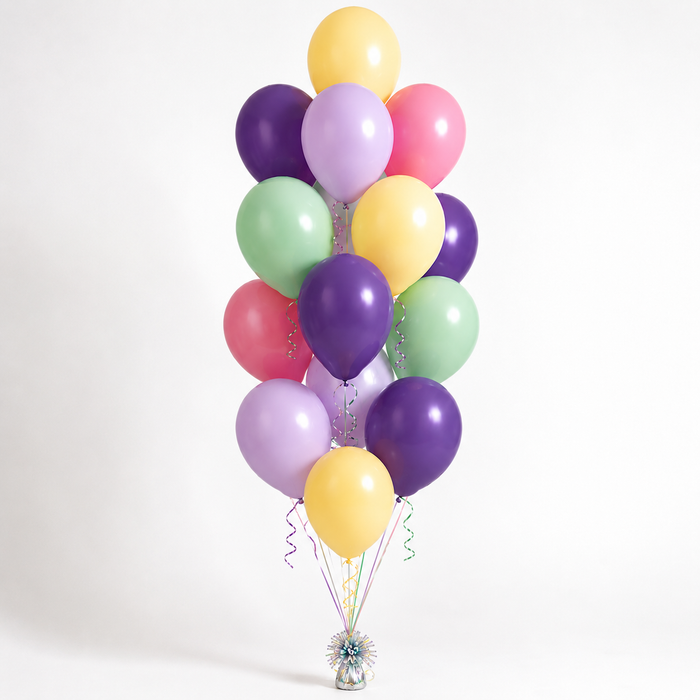 Happy Unicorn themed accent balloon bouquet with 17 pastel and purple latex balloons in yellow, mint green, pink, lilac, and classic purple, arranged with curling ribbon.