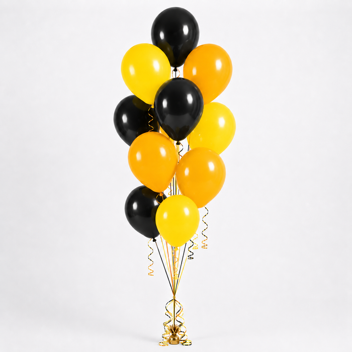 Harry Potter Hufflepuff themed balloon bouquet with black, classic yellow, and golden yellow latex balloons arranged with matching curling ribbon and a balloon weight.
