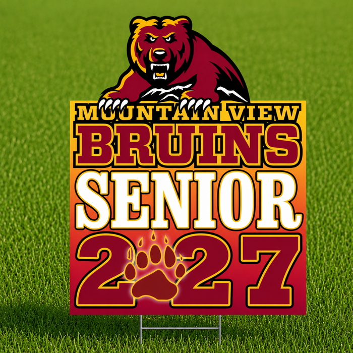 A rectangular yard sign on a metal stand placed on green grass, featuring a red and gold gradient design with the text 'MOUNTAIN VIEW BRUINS SENIOR 2027' and a bear graphic above. The sign is shown as the product in a lawn setting.