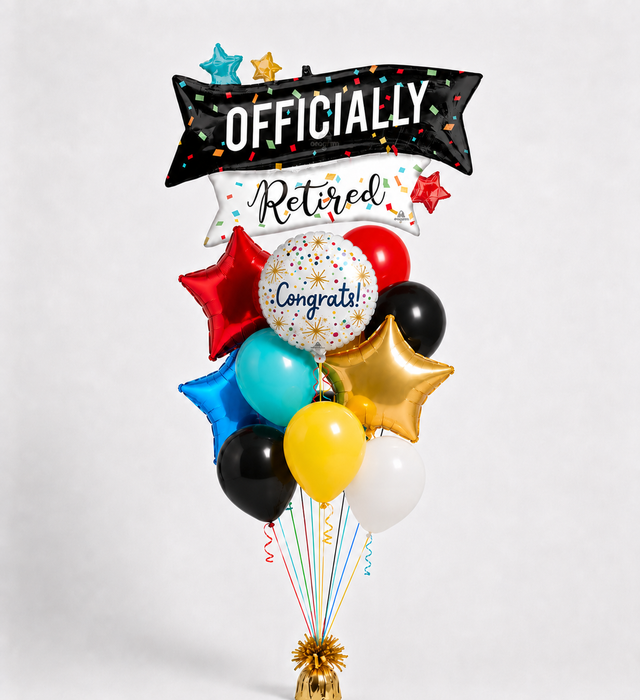 A retirement-themed balloon bouquet centerpiece with a black and white banner reading 'OFFICIALLY RETIRED,' a white round mylar reading 'Congrats!,' and multiple metallic and latex balloons in red, blue, yellow, black, white, and gold on a light gray background.
