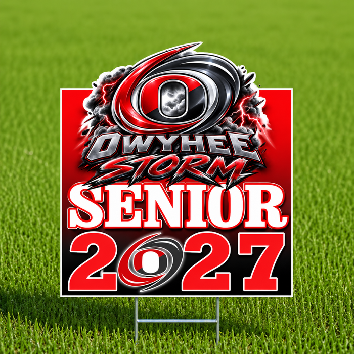 A rectangular yard sign on a metal H-stake, featuring a red, black, and white 'Owyhee Storm Senior 2027' logo, photographed standing on green grass.