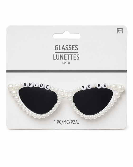 Retro Bride Sunglasses featuring white pearl-accented cat-eye frames, dark lenses, and “Bride To Be” letter beads across the top, packaged as a 1-count bridal accessory.
