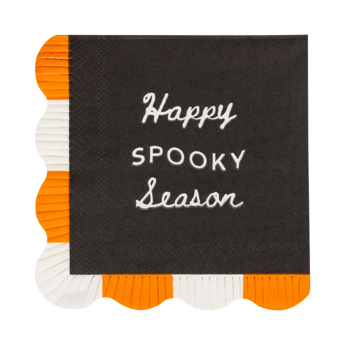 Black napkin with 'Happy Spooky Season' text, surrounded by orange and white scalloped edges