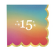 Square beverage napkin with rainbow gradient background, gold scalloped edge, and white “15” milestone number with star accents, shown on a white background.