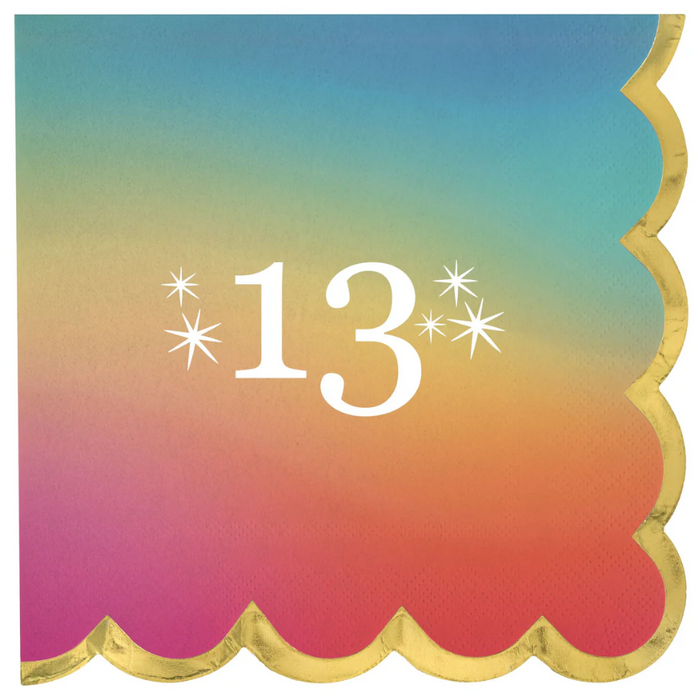 Square beverage napkin design featuring a rainbow ombré gradient background with gold scalloped edging and white “13” milestone number with starburst accents for a 13th birthday celebration.
