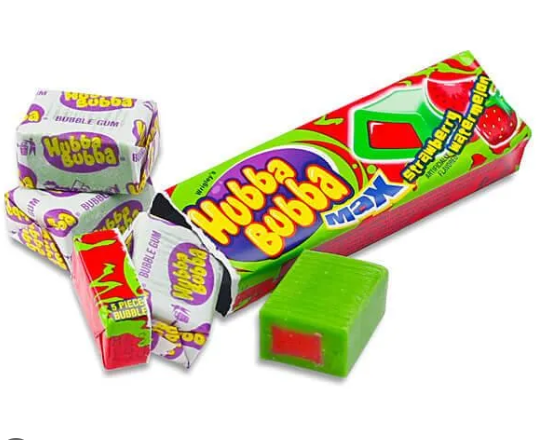 Hubba Bubba Max bubble gum candy shown with several individually wrapped gum pieces, a long box of strawberry-flavored gum, and one loose green bubble gum cube with a red center on a white background.