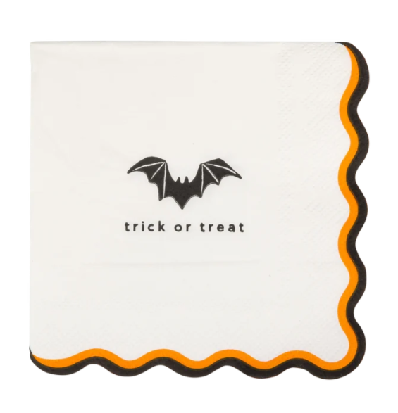 A square white paper napkin with scalloped edges, featuring a black bat graphic and the words 'trick or treat' in black text. The napkin is decorated with an orange and black scalloped border.