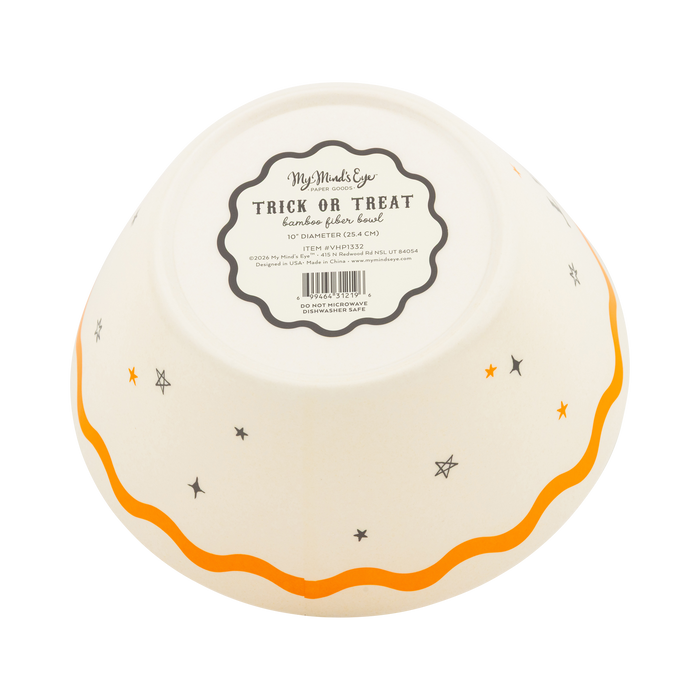 Round white bowl with orange rim and Halloween-themed design on a white background