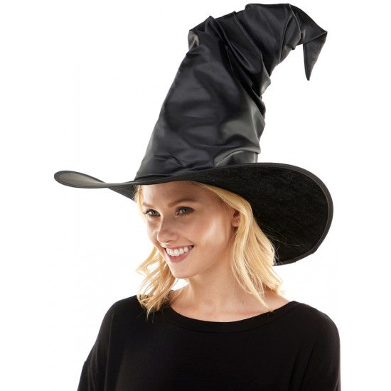 A women wearing an adult sized black witch hat.