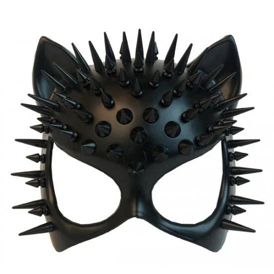 Black cat-shaped mask with pointed ears and sharp spikes covering the crown and sides, featuring eye holes and studded details across the forehead.