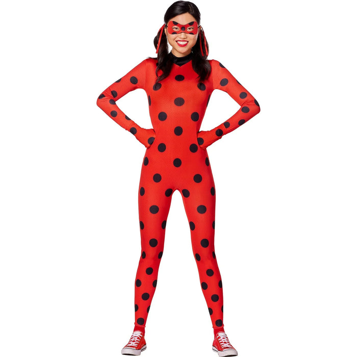 Red full-body spandex costume covered in black polka dots, paired with a matching red eye mask and red hair ribbons, worn with red canvas sneakers.