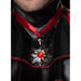 Man wearing a ornate silver medallion with a red jeweled center on a red ribbon around his neck over black clothing.