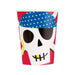 White paper cup featuring a smiling skull face with black eye sockets and stitched mouth, wearing a blue polka-dotted pirate hat and gold hoop earring, with red sections on the sides.