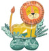 Uninflated foil balloon shaped like a smiling yellow lion with an orange mane, surrounded by green leaf decorations and a matching green base with a bow.