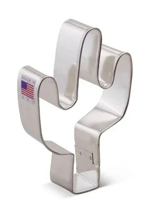 White metal cactus-shaped cookie cutter with an American flag label on the handle, shown standing upright against a white background.