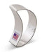 Curved silver metal crescent moon-shaped cookie cutter with American flag label on white packaging, shown against white background.