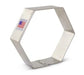 Stainless steel hexagon-shaped cookie cutter with a "Made in USA" label featuring an American flag on the side.