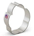 Stainless steel paw print-shaped cookie cutter with scalloped edges and a small American flag label visible on the side.