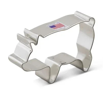 Metallic silver pig-shaped cookie cutter with a sturdy metal frame and small label on the top surface.