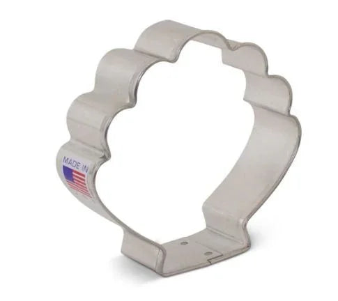 Aluminum seashell-shaped cookie cutter with scalloped edges and a "Made in USA" flag label visible on the side.