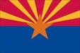 Arizona state flag featuring a red and gold sunburst design above a blue band with a centered gold star.