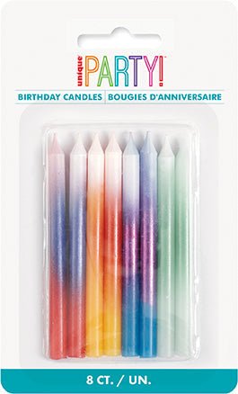 Set of 8 colorful ombre birthday candles in gradient shades of pink, orange, purple, and green arranged in a clear plastic package.