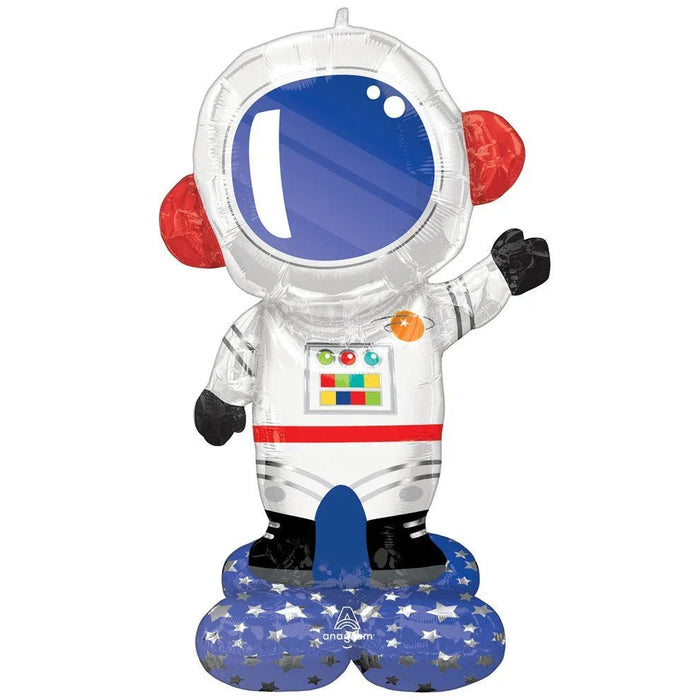 Clear astronaut-shaped foil balloon with blue helmet visor, white suit, red gloved hands, black boots, colored chest panel details, and blue star-patterned base stand.