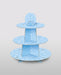 Light blue three-tiered cupcake stand with cloud pattern design and support feet, displayed against a neutral background.