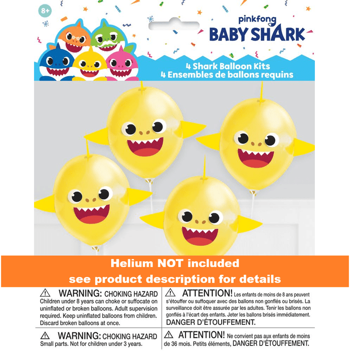 Four yellow latex balloons with smiling Baby Shark faces, yellow fin attachments, and hanging strings displayed against a gray background.