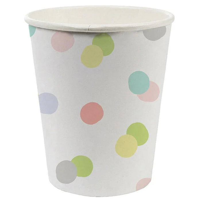 White paper cup with colorful polka dots in pink, green, yellow, blue, gray, and mint scattered across the surface.