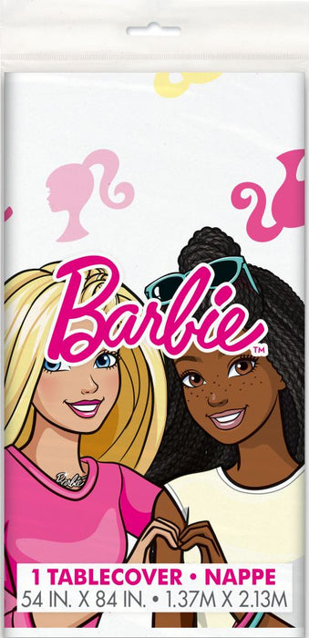 Barbie plastic tablecover featuring two smiling girls with blonde and black hair, bright pink Barbie logo, and silhouettes of Barbie characters on white background, measuring 54 by 84 inches.