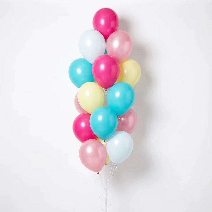 Balloon bouquet featuring hot pink, light pink, aqua, pale yellow, and white latex balloons with curling ribbons.