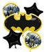 Black and yellow Batman-themed mylar balloon bouquet with five pieces including a large bat symbol balloon, two black star balloons, and two circular Batman portrait balloons with yellow polka dot accents.