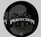 Black spherical foil balloon with gold and white text reading "Aged to Perfection" and decorative flourishes, with partial text visible on the left side.