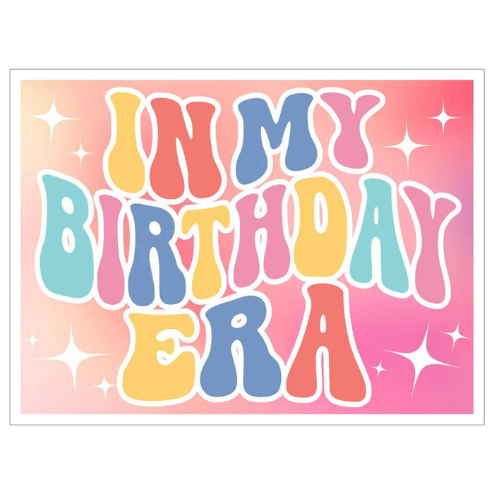 Colorful yard sign featuring "ON MY BIRTHDAY ERA" text in rainbow letters with white outlines on a pink gradient background decorated with white sparkle accents.