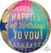 Colorful 15-inch foil balloon with a gradient background transitioning from pink to blue, featuring gold text reading "Happiest of Birthdays to You!" and decorative gold scallop patterns around the top and bottom edges.